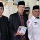 Kepala KUA Hilgum Serahkan 75 Al-Qur’an untuk Masyarakat Jorong Sianggai-Anggai
